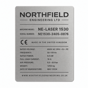 Laser engraved machine plate with fictional company branding and technical data on brushed metal